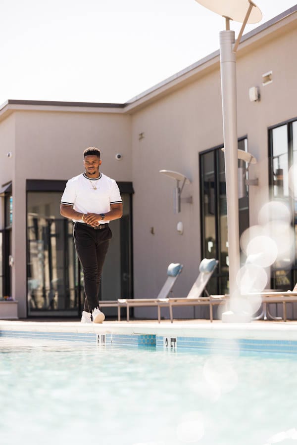 Man Walking on Poolside