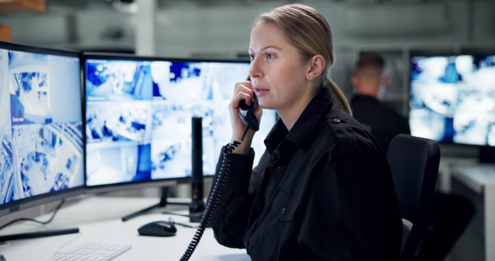 Communication, security and woman with telephone, monitor and watch of cctv, danger and control room. Guard, transceiver and working for protection, safety and talking to backup and connection Call Center Security