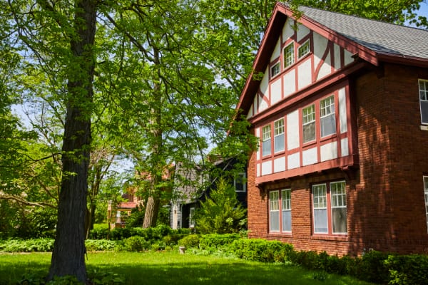 Tudor Style House in Lush Suburban Setting, Eye-Level View Tudor Style Home