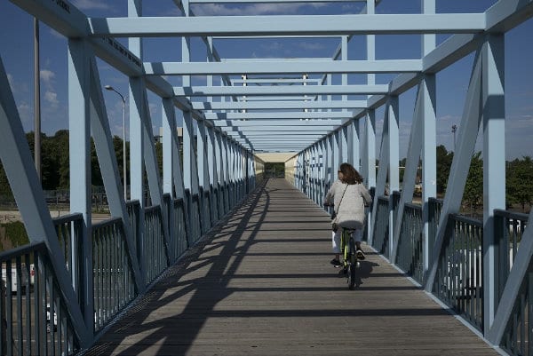 Woman cycling on Irene Hixon Whitney Bridge in Minneapolis, Hennepin County, Minnesota, USA Cycling Irene Hixon Whitney Bridge